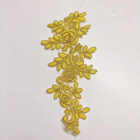 Glittrig applikation på mesh. Yellow