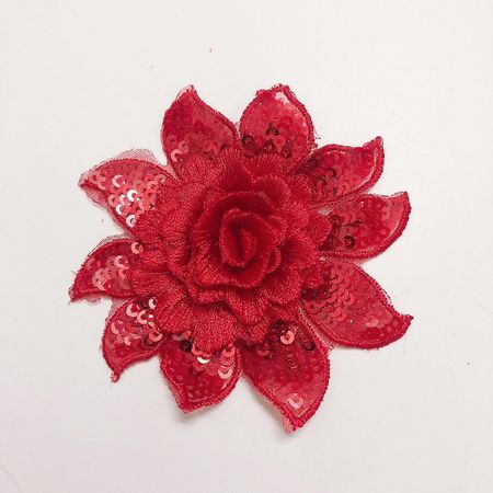 Dekorativ blomma med paljetter ca 7-8 cm. Röd