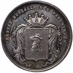 Oskar II - Skånska Hushållningssällskapet 1875 av Lea Ahlborn - En stor och pampig silvermedalj