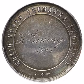 Oskar II - Växjö högre allmänna läroverks belöningsmedalj i gymnastik, tilldelad K. Lüning 1894