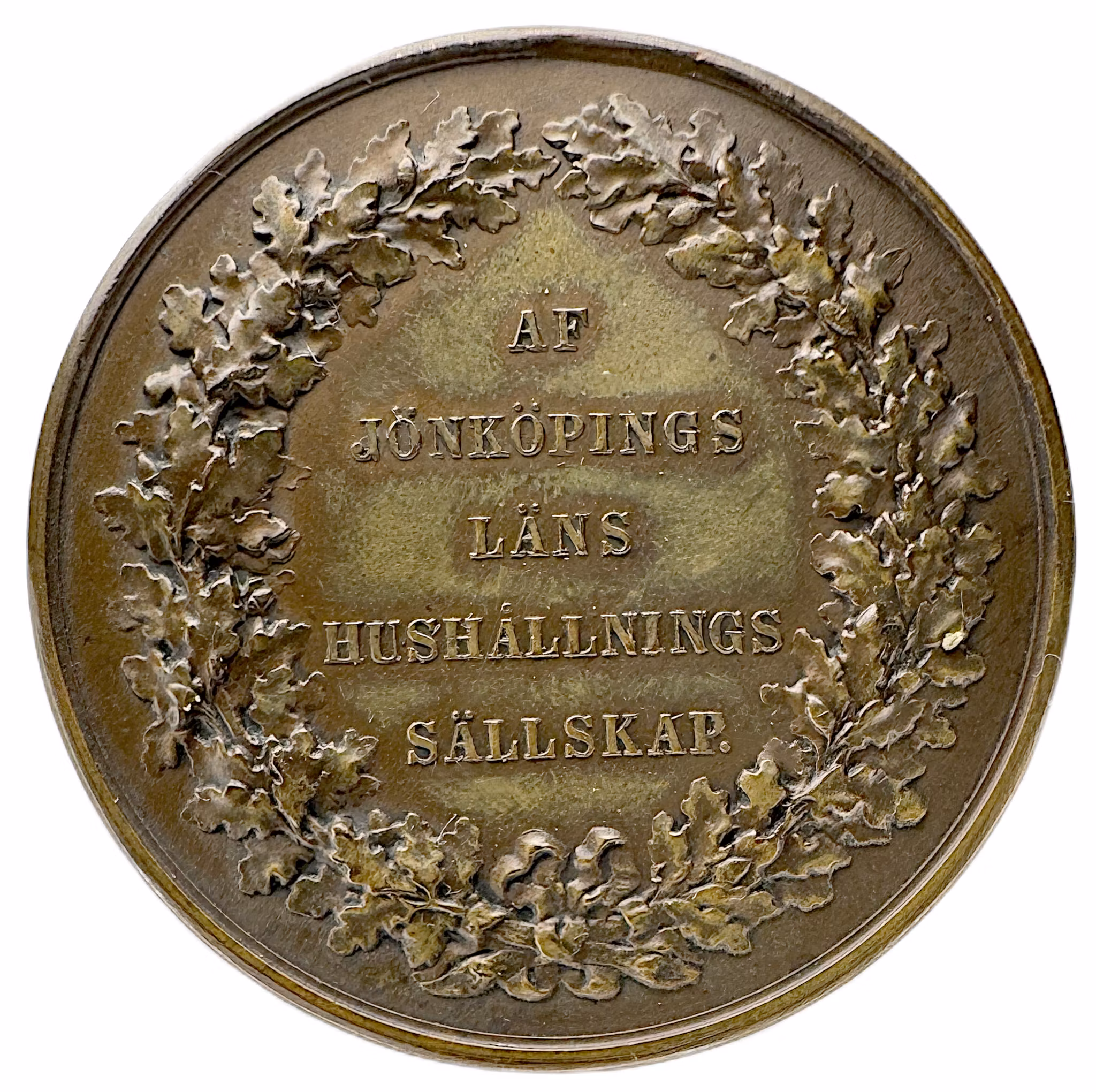 Oskar II: Jönköpings läns kungliga hushållningssällskap (modell 1873) av Lea Ahlborn - En hyllning till den småländska fliten
