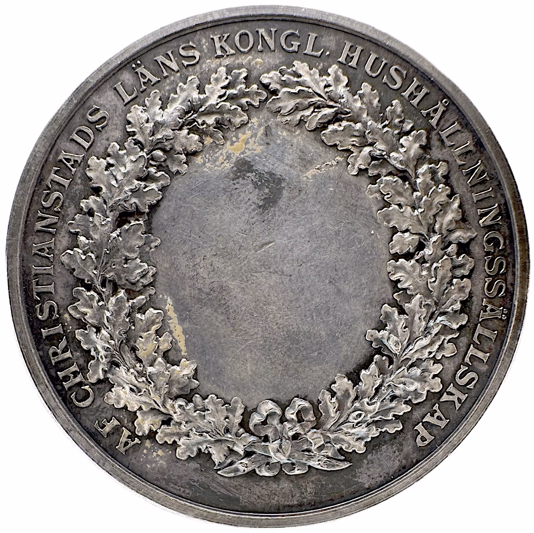 Oskar II - Kristianstads läns kungliga hushållningssällskap (modell 1892) av Lea Ahlborn - Silvermedalj med härlig blåguldskimrande bottenlyster