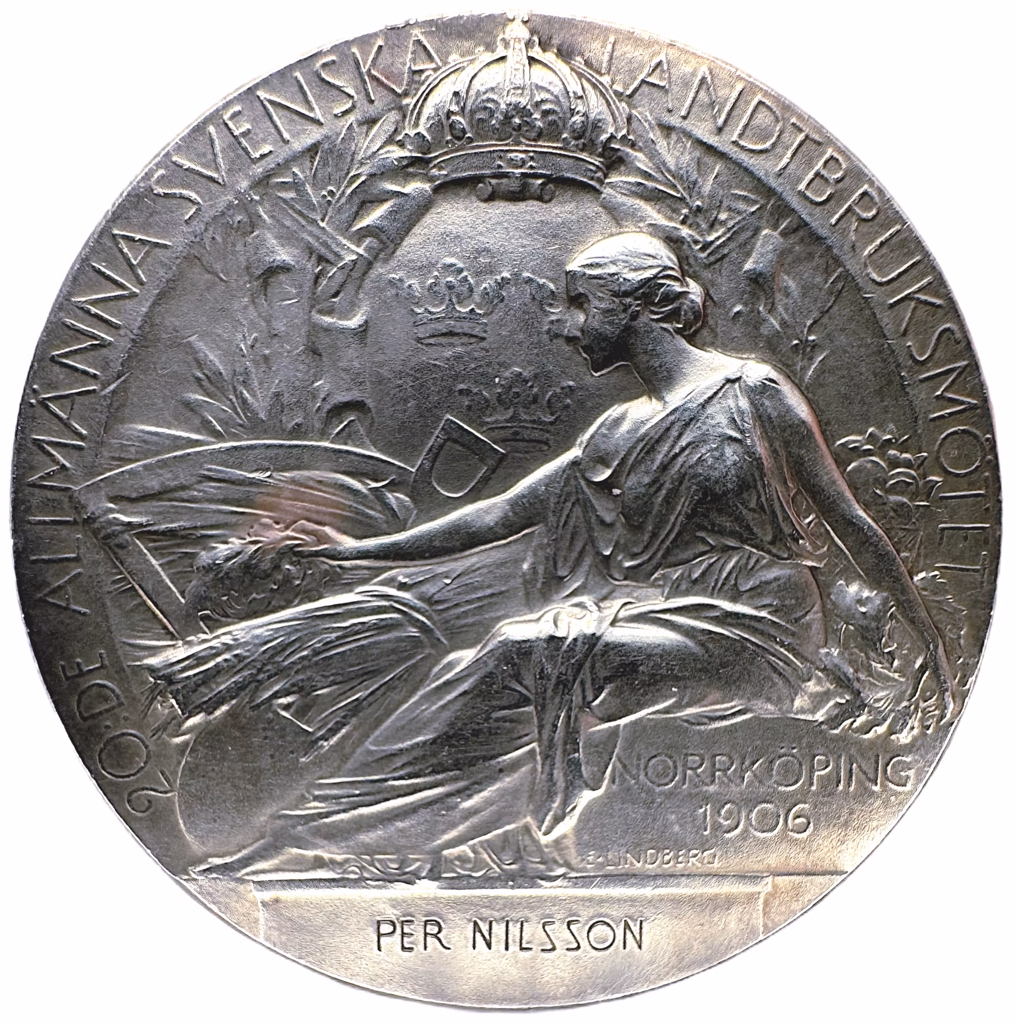 Oskar II - Belöningsmedalj i silver vid 20:e Allmänna svenska lantbruksmötet i Norrköping 1906 av Adolf Lindberg - Utdelad till Per Nilsson