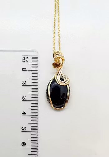 Halsband Swirly i 925 sterlingsilver och mässing med svart agat