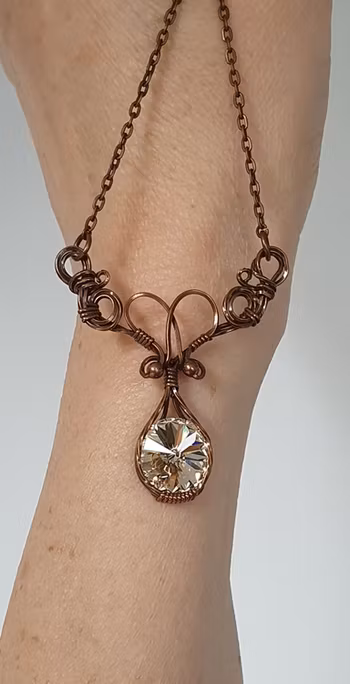 Halsband Luscious Loops Wings i koppar med Light Silk Swarovski kristall