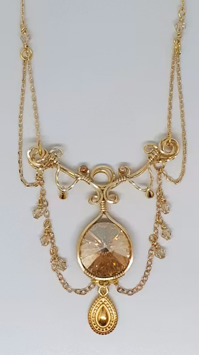 Halsband Enchanted Chains i mässing med Golden Shadow Swarovski kristaller