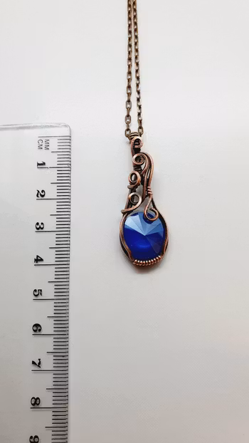 Halsband Luscious Loops i koppar med Royal Blue Swarovski kristall
