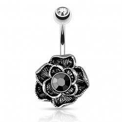 Navelpiercing med svart blomma