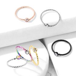Piercingring flätad med ädelsten