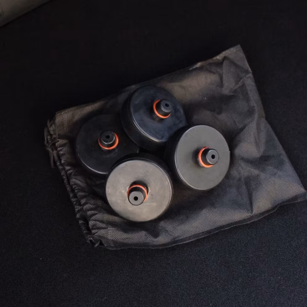 4 st 20 mm jack pads i en svart påse