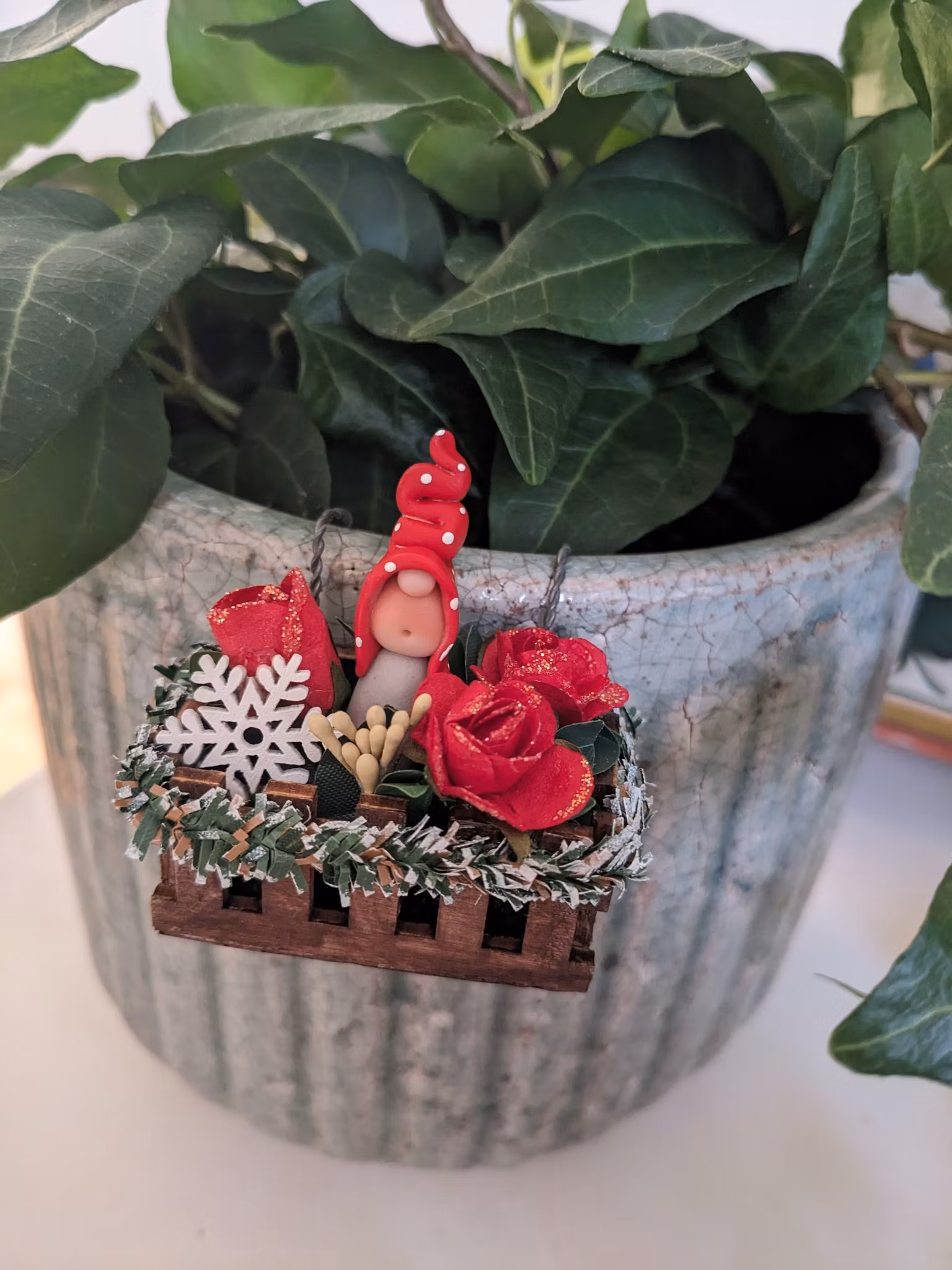 Miniblomlåda att hänga på blomkruka