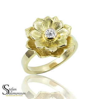 Gold lotus ring with a diamond