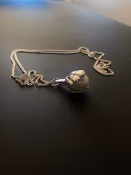 Pearl in shell pendant