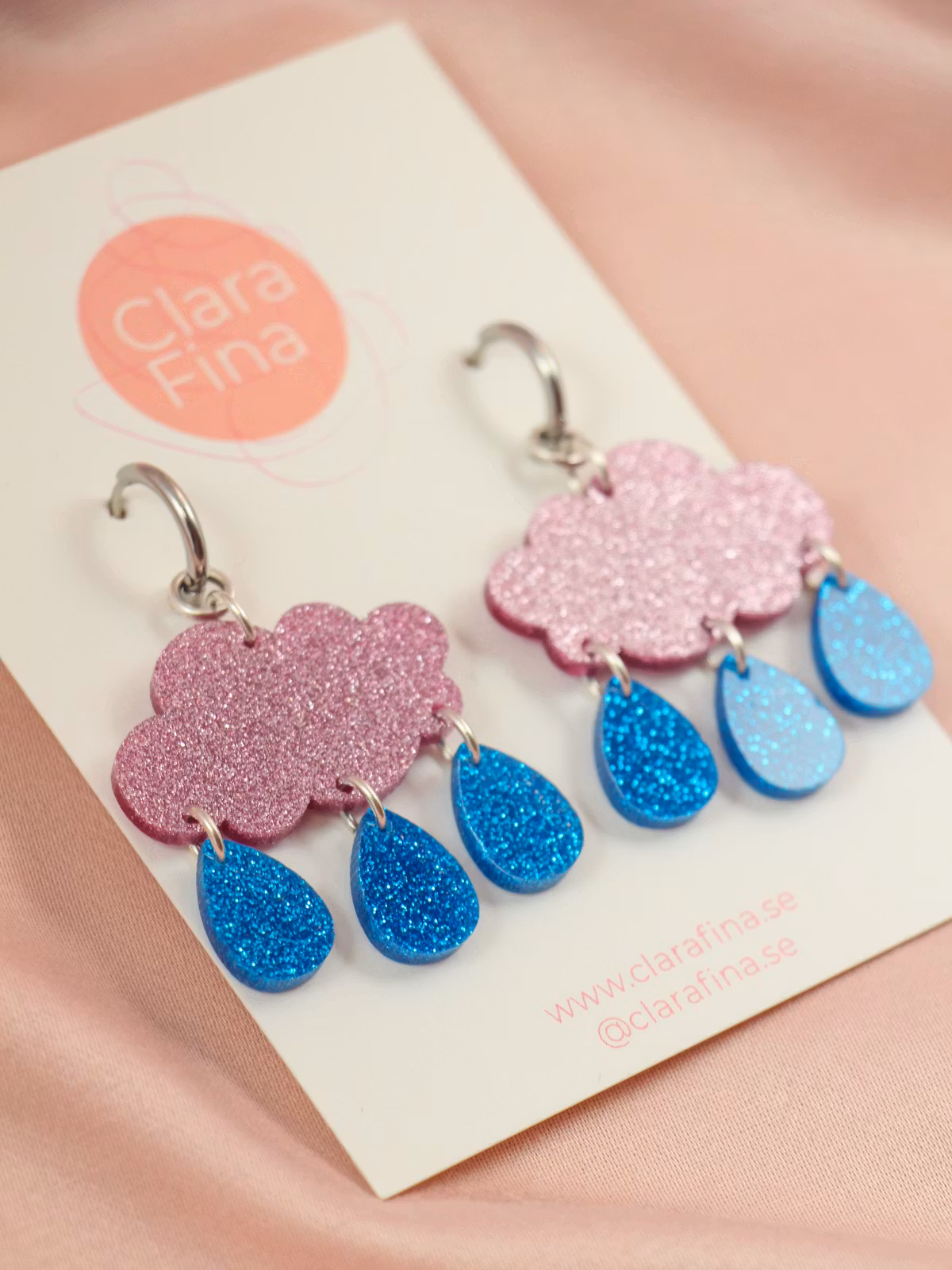 Små regnmoln på ring rosa glitter