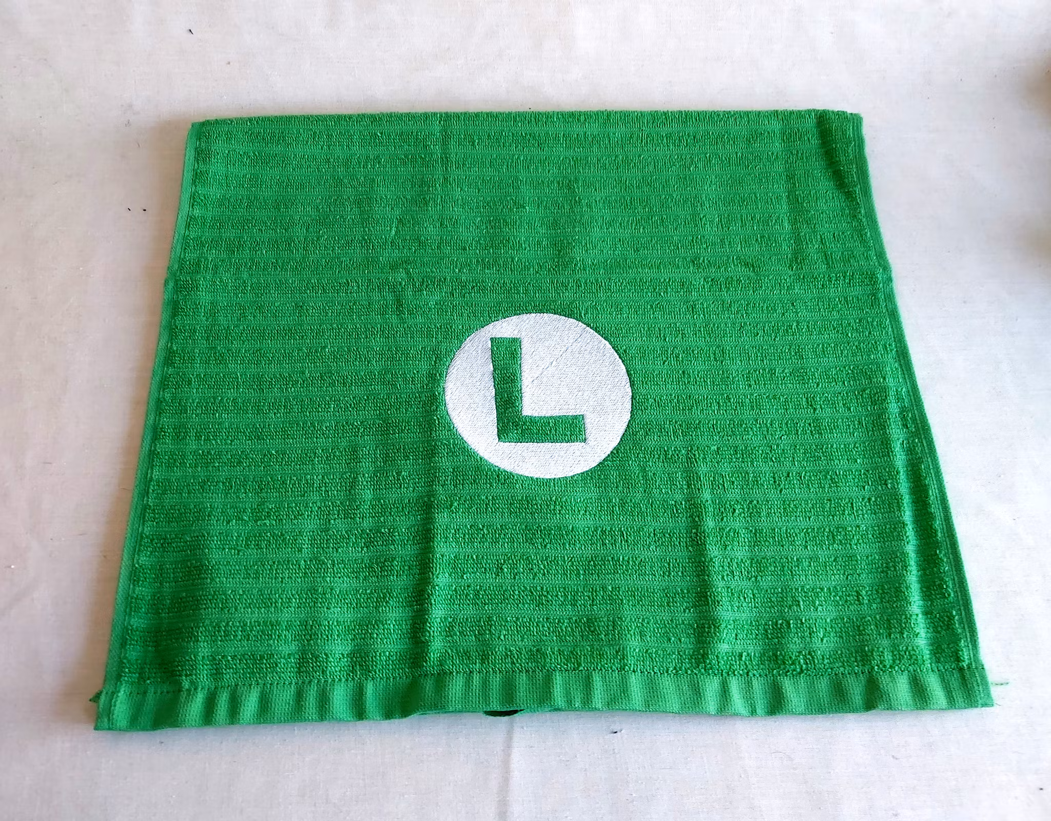 Gästhandduk - Super Mario logo - Luigi