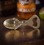 Flasköppnare / kapsylöppnare, i form av ekollon i genomgjuten mässing från Gusums Messing