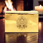 Matchbox in polished brass with lion mascaron