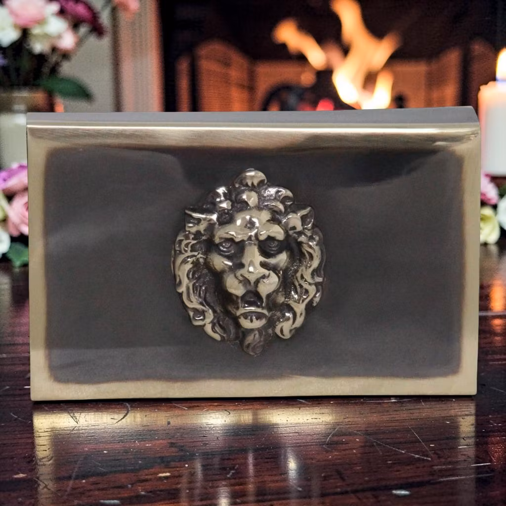 Matchbox in antique brass with lion mascaron