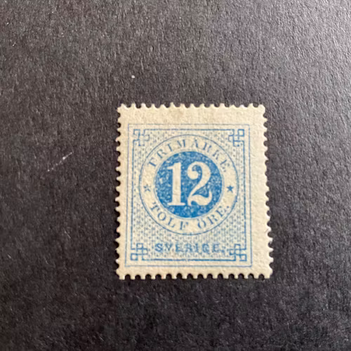 Ringtyp T 14 facit 21 m blå, märket  är omgummerat