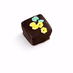 Mörk choklad med hasselnöts pralinéfyllning och krisp, dekorerad med blommor av kristyr (Innehåller NÖTTER & GLUTEN)