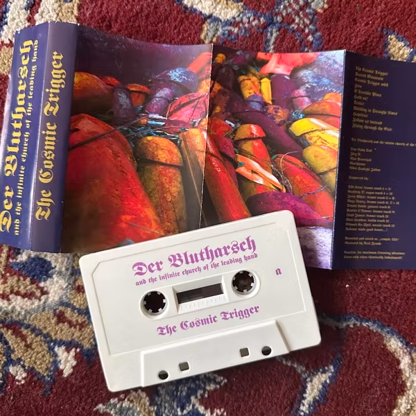 DER BLUTHARSCH AND THE INFINITE CHURCH OF THE LEADING HAND The Cosmic Trigger (WKN - Austria original) (VG+) TAPE