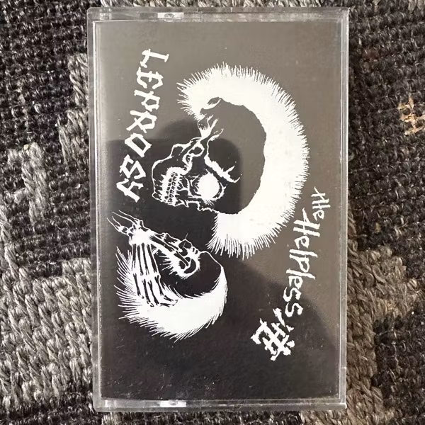 HELPLESS, the / LEPROSY Split (Black Shit Noise - USA original) (NM) TAPE