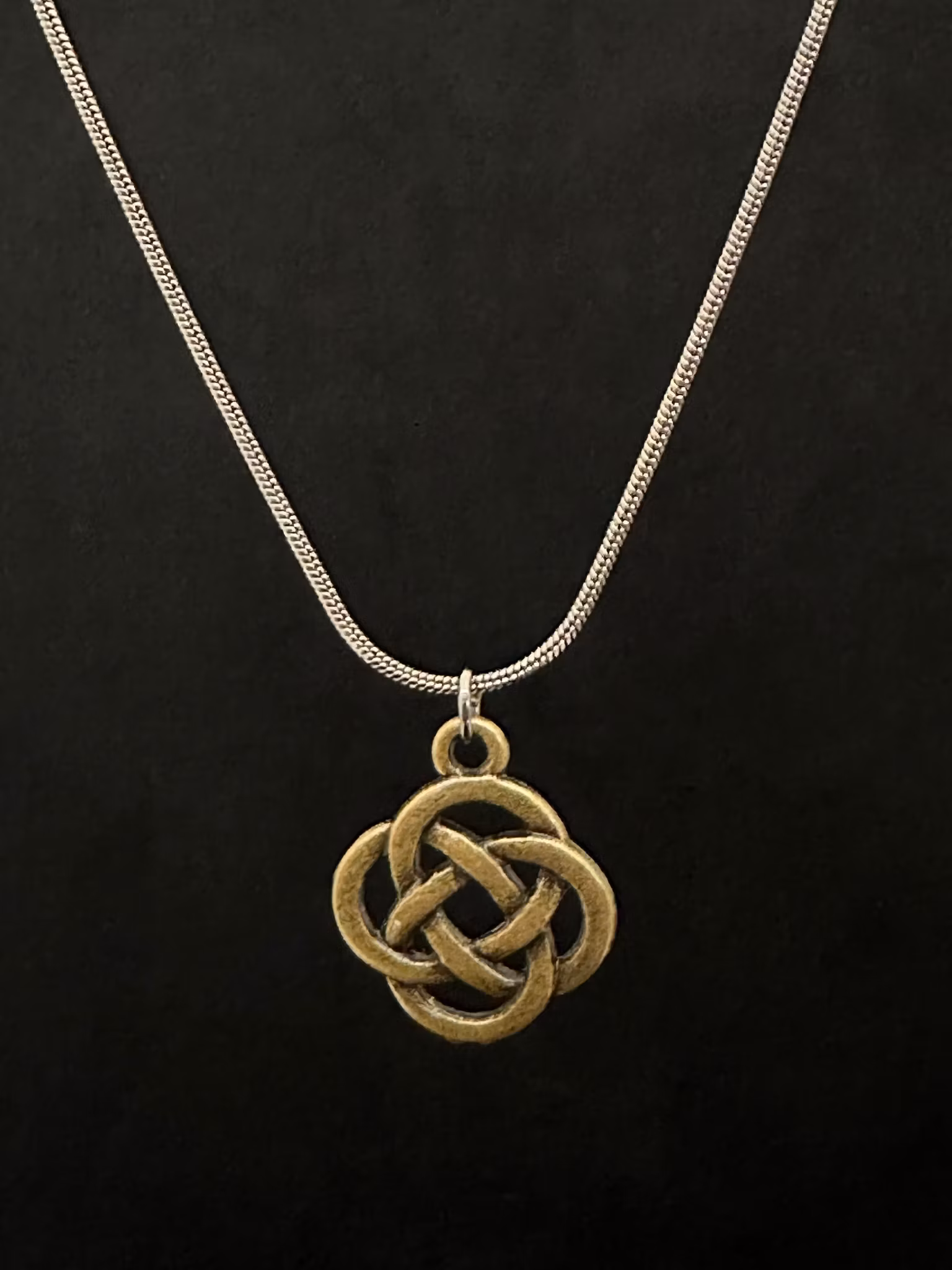 Knot charm necklace