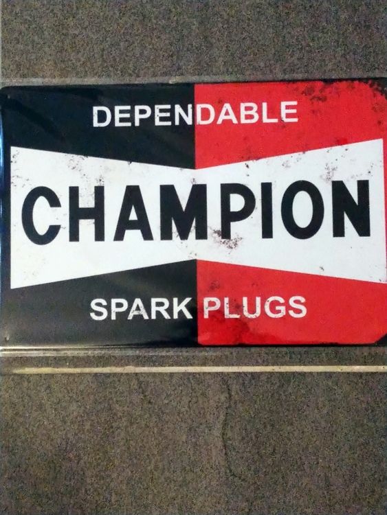 Plåtskylt Champion