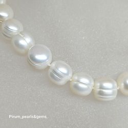 Halsband med stora runda vita sötvattenpärlor 10-11mm