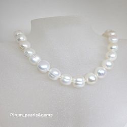 Halsband med stora runda vita sötvattenpärlor 10-11mm