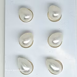 Vita droppformade pärlor i par 8,5-9x11 mm