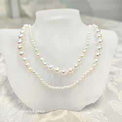 Långt halsband med vita japanska saltvattenpärlor 3-8,5 mm