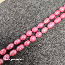 Mörk rosa ovala pärlor 7x9 mm