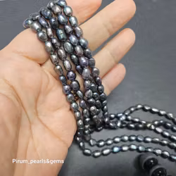 Blå-gröna avlånga pärlor 6-7 mm