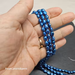 Klarblå ovala pärlor 6-7 mm