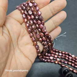 Röda ovala pärlor 6-7 mm