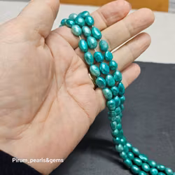 Mörkt turkosa pärlor 8x10 mm