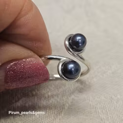 Silverring med två blå pärlor