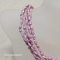 Fem rader fantastiska cerisefärgade pärlor med silverlås