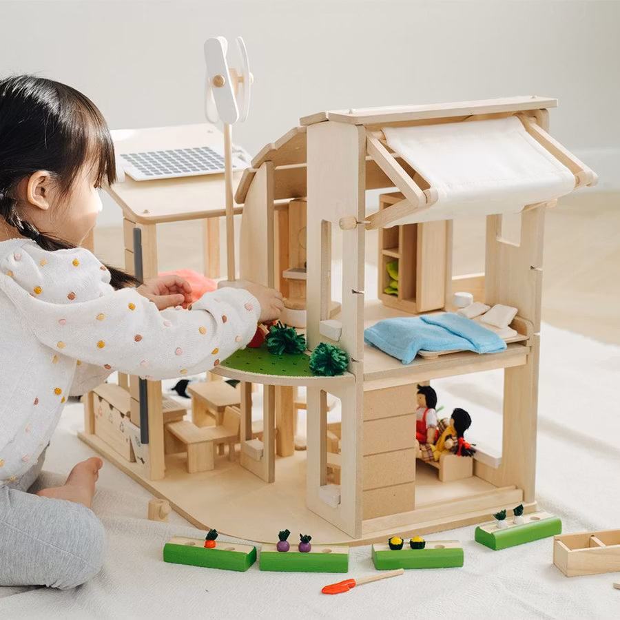 Green dollhouse with furniture