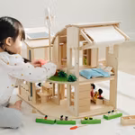 Green dollhouse with furniture