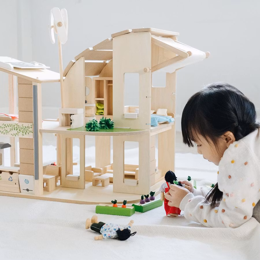 Green dollhouse with furniture