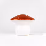 Svamplampa mellan tegel