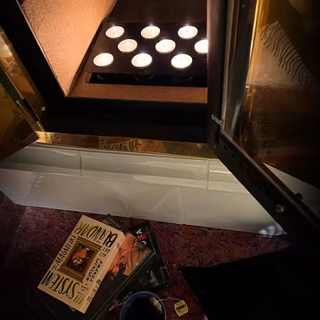 Ljushållare för braskamin, öppen spis