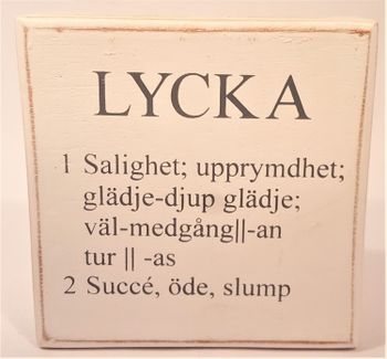 Liten låda med text "Lycka"