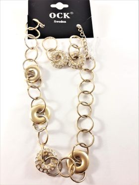 Dekorativt och vackert lyxhalsband och örhängen, guldfärgat med strass