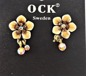 Emaljerat, brunt örhänge i form av fembladig blomma och strass