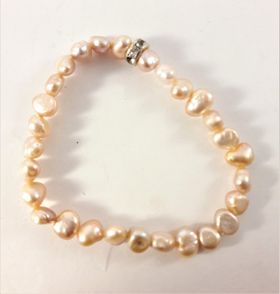 Enkelt Armband med Små Aprikosfärgade Pärlor och Ring med Strass