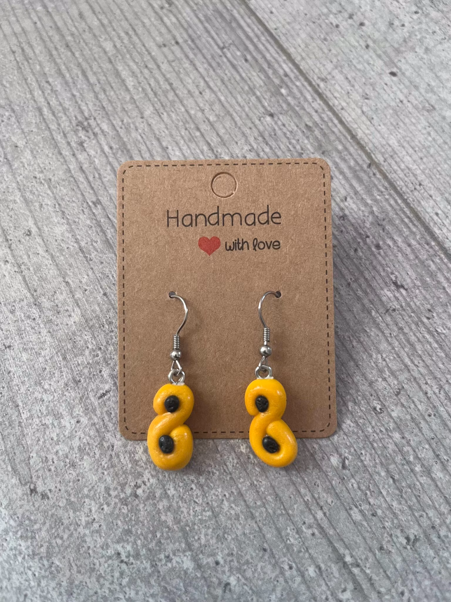 ÖRHÄNGE, LUSSEKATT