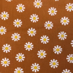Bomullstyg blommor lejongult